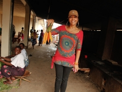 Christine Schuler Deschyrver shows off carrots from the V-World Farm. City of Joy, February 2013, Bukavu, DRC